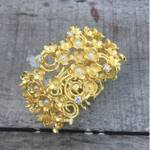 Statement Floral Bracelet With A Twist